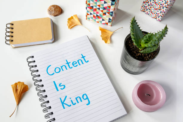 Content Is King written in notebook on white table